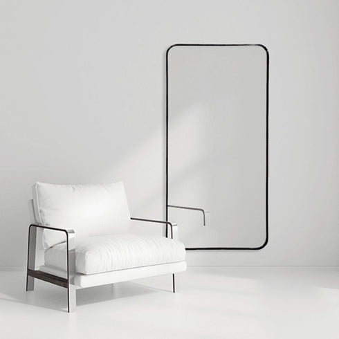 Callan Black Wall Mirror styled in a modern bedroom