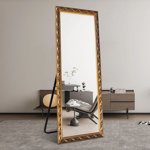 Ornate gold arched full length mirror styled in elegant living room