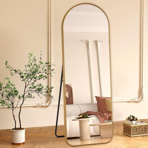 Front view of Elandor full-length gold standing mirror in living room