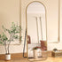 Front view of Elandor full-length gold standing mirror in living room