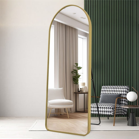 Elandor full-length gold standing mirror in bedroom