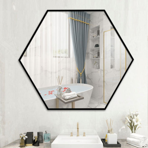 Hexagon wall mirror styled in a modern bathroom