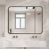 Tayla Rounded Edge Black Wall Mirror above a modern bathroom vanity