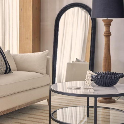 Full-length Flora Black Arched Wall Mirror, 82cm wide, styled in living room