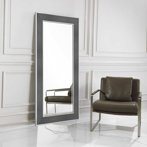 Siena stainless steel full-length mirror leaning against wall in modern living room