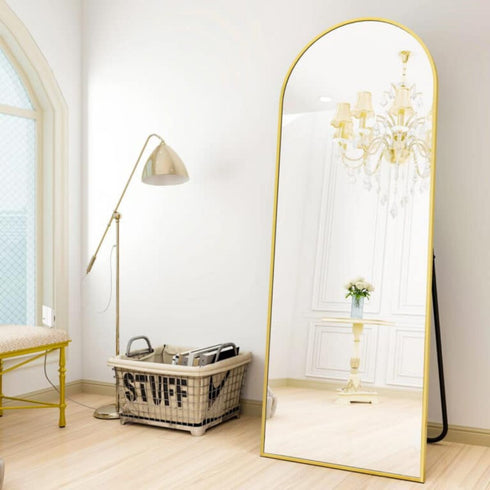 Full-length Levi freestanding mirror with rose gold aluminium frame and arched top, ideal for bedrooms or walk-in wardrobes