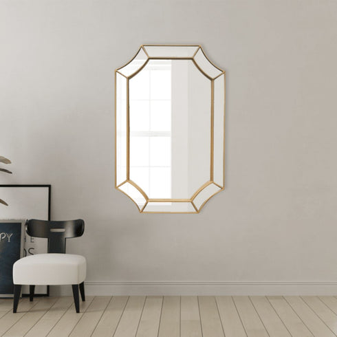 Gold irregular wall mirror styled in modern living room