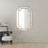 Gold irregular wall mirror styled in modern living room