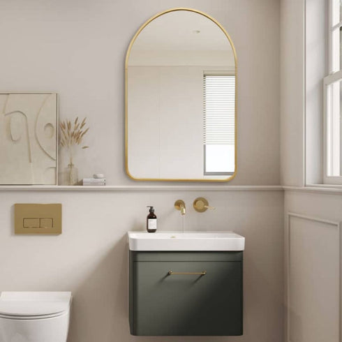 Stylish 80x100cm gold arched mirror mounted in a bathroom