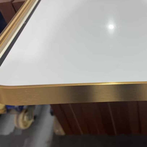 Side view showing slim gold aluminium arch mirror frame