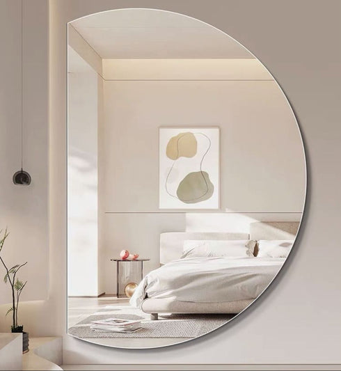 Wall-mounted Meira crescent mirror with minimalist decor