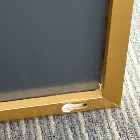 Side angle of oversized Navi gold standing mirror with slimline frame