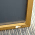 Side angle of oversized Navi gold standing mirror with slimline frame