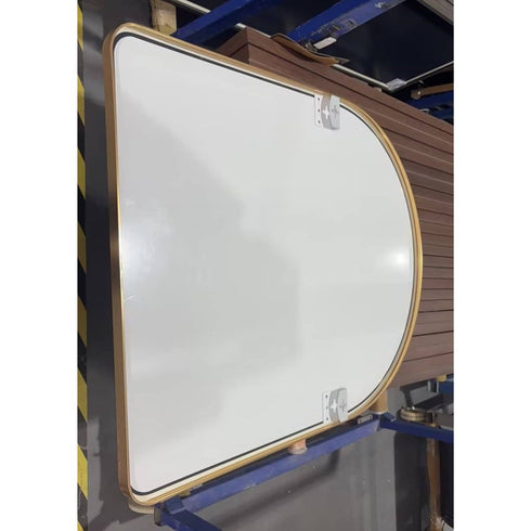 Back view of gold arched wall mirror showing wall-mounting hardware