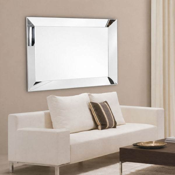 Maddox modern silver rectangular wall mirror above a sofa